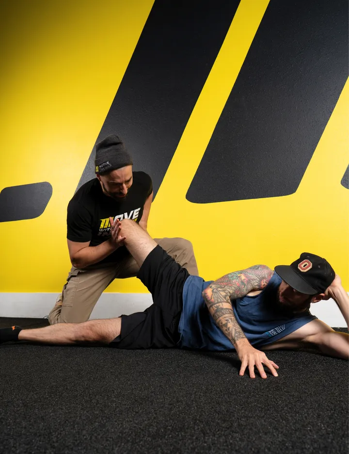 Motive Training coaches guiding clients through FRC joint mobility work