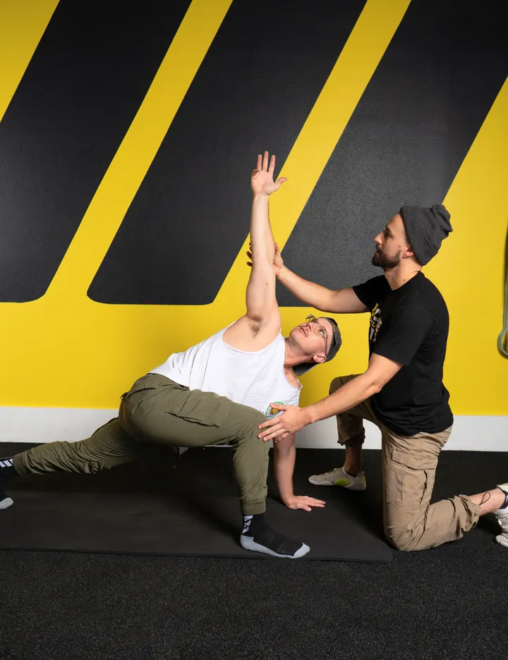 Experienced South Austin personal trainer performing a functional range assessment.