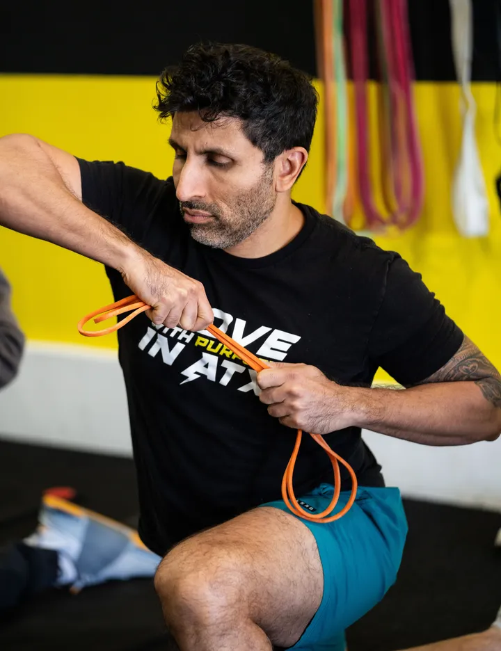 Client building active range of motion and joint control in mobility class